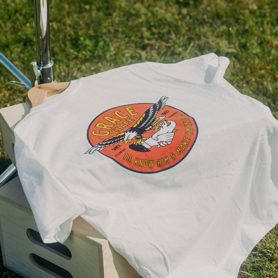 a white t - shirt with an eagle on it