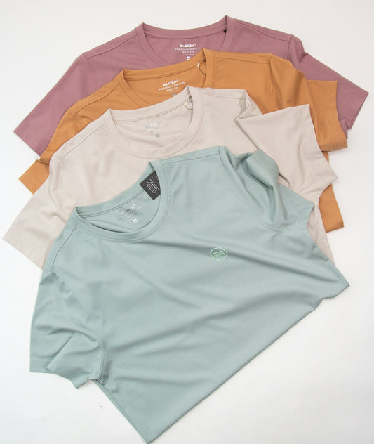 a group of five t - shirts sitting on top of each other