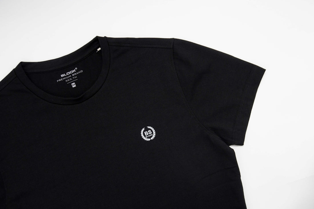 a black shirt with a white logo on it